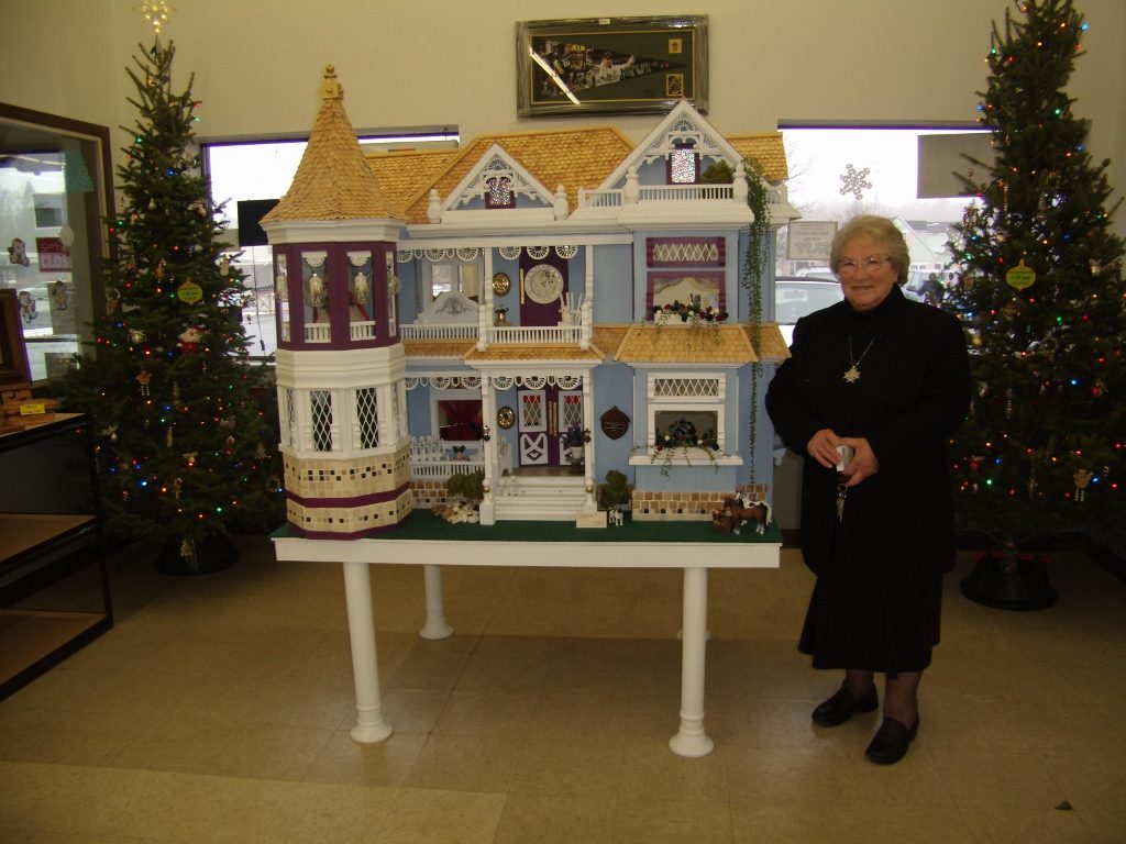 Shirley Wagner customized a basic pattern to build this dollhouse. It stands 4' by 2' by 3', and the roof comprises more than 5,000 shingles.