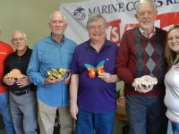 Pictured are Chuck Fleming of Toys for Tots, Claude Drevet, Terry Nicholson, Brian Beals, Cecil Schneider, and Amy Brannon-Hamby of Toys for Tots.