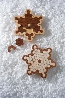 Cut a Pair of Challenging Snowflake Puzzles