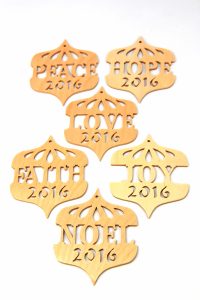 Sue Mey's ornaments feature the year and messages of peace and joy.